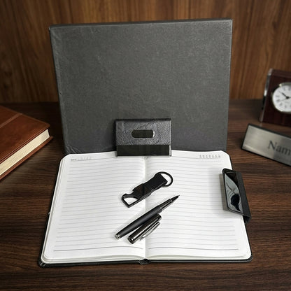 Personalized Black 4-in-1 Executive Gift Set with premium diary, metal pen, card holder & keychain. Ideal for employees, clients, managers, welcome kits, conferences, corporate events and bulk business gifting. MP4919